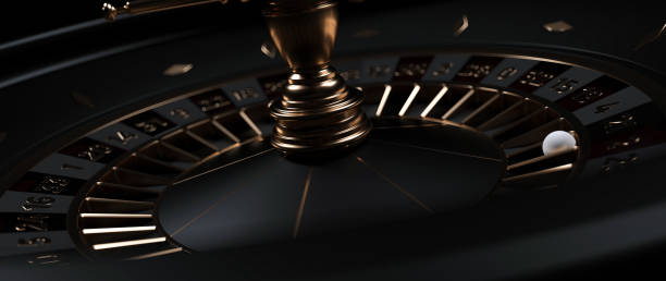 Modern Black And Golden Casino Roulette Wheel On Black Background. Close Up.